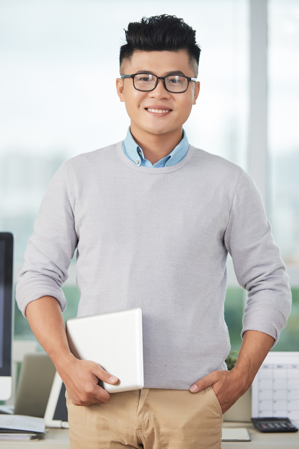 cheerful asian designer with tablet VUKY7FT