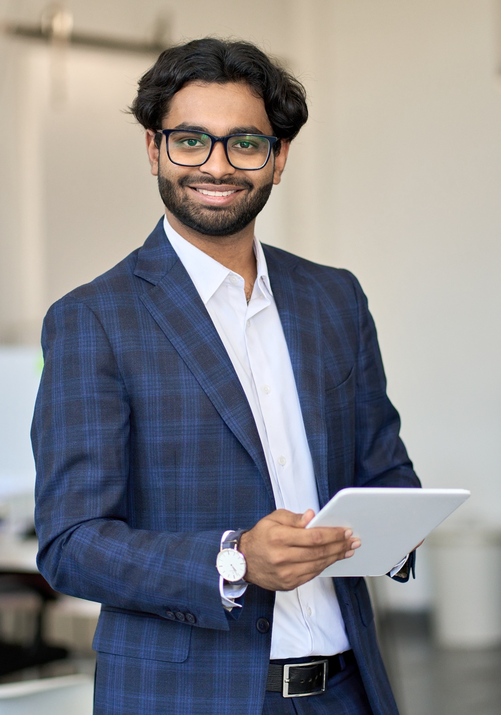 smiling young indian business man wearing suit hol 47HH9XN